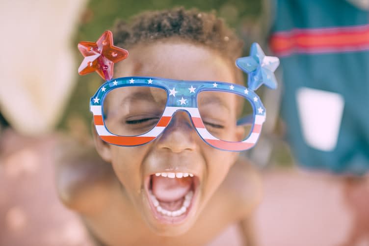 A child wearing American Flag glasses on the 4th of July