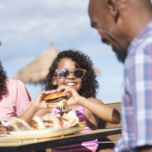 A family enjoys a meal outside in Daytona Beach