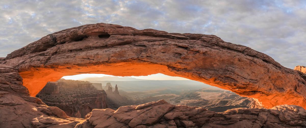 Mesa Arch, illuminated by the sun, located in Canyonlands National Park near Moab, Utah.