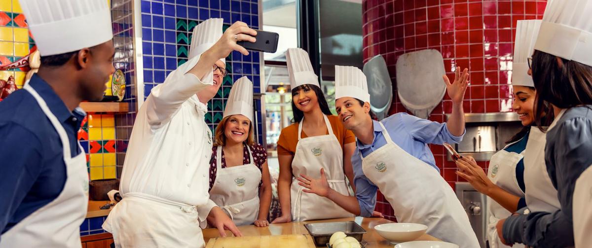 Professional group dressed as chefs in kitchen