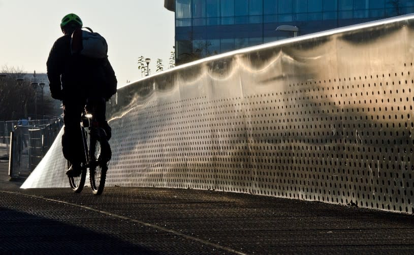 A man cycling acorss Meads Reach Bridge - Credit Jeff Lucas