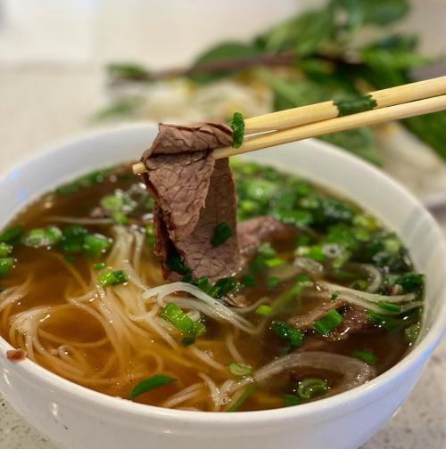 Bowl of pho soup with noodles and beef at Pho at Telfair