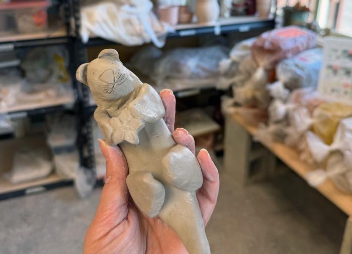 Hand-sculpted clay otter made during a ceramic art class.