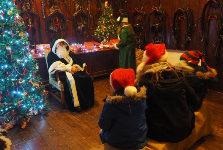 Kids meeting father christmas at arlington court