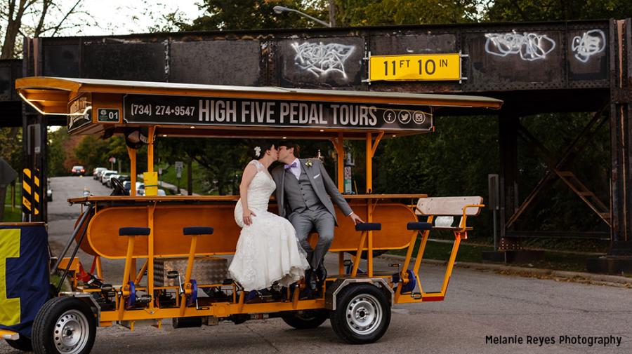 Couple kissing on High Five Pedal Tours