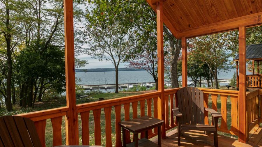 Cabin porch with lake in background at Seneca Lake Resorts