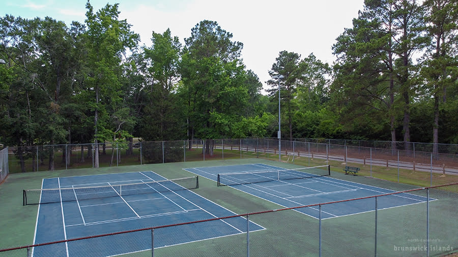 an aerial view of two tennis courts with pickleball court markings overlayed at the Shallotte Township District Park