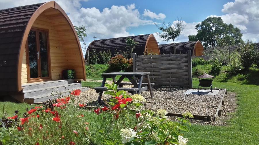 Three glamping pods with their own private picnic and BBQ area at Notgrove Holidays