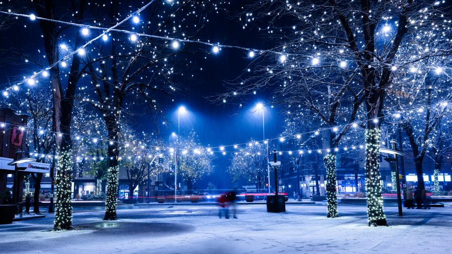 A plaza with lights in the snow