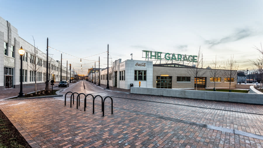 The Garage exterior. Large brick building with sign "The Garage" 