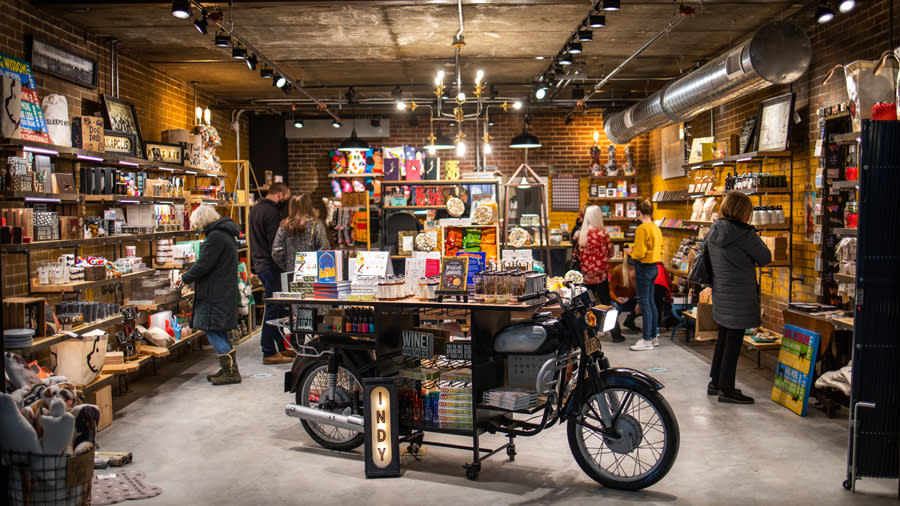 Shop with people browsing shelves