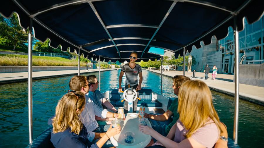 Visitors enjoy a guided cocktail cruise on the Central Canal