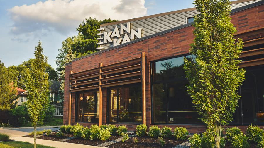 Kan Kan outside, sign reads "Kan Kan"