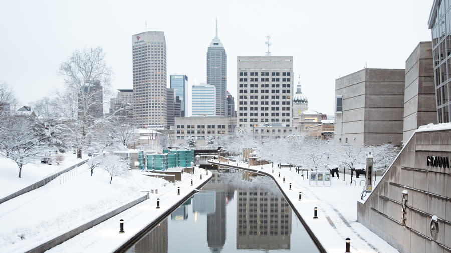 Snow on the Central Canal, with the skyline of Indianapolis visible. 