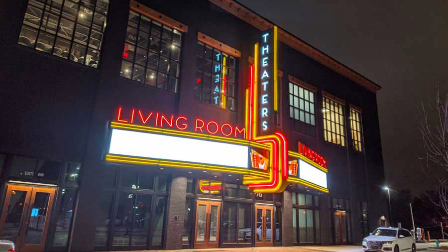 Large building with sign saying "Living Room Theaters"