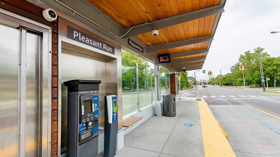 bus station with the words "Pleasant Run" on the side