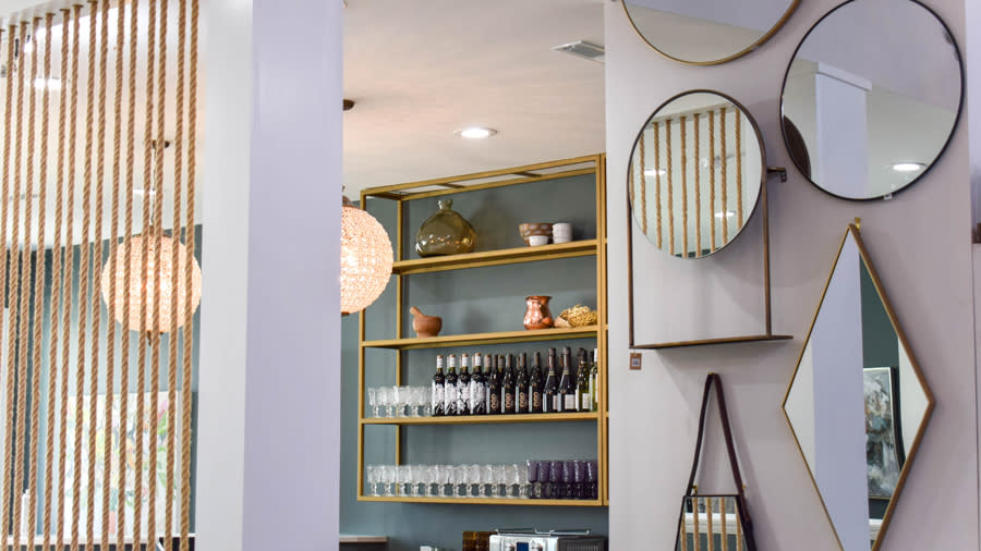 An indoor shop with gilded mirrors and home décor
