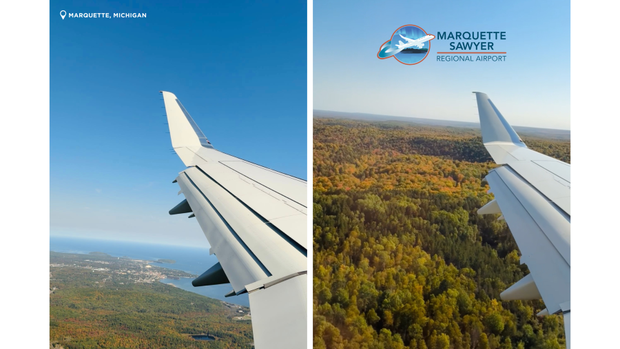 An aerial view of Lake Superior and fall foliage from the airplane window flying over Marquette, MI.