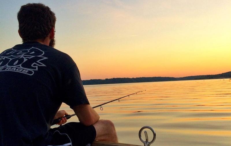 Fishing on a boat in Monroe Lake