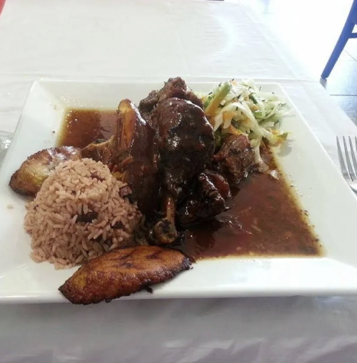 A plate of jerk chicken and rice from Tropical Flava