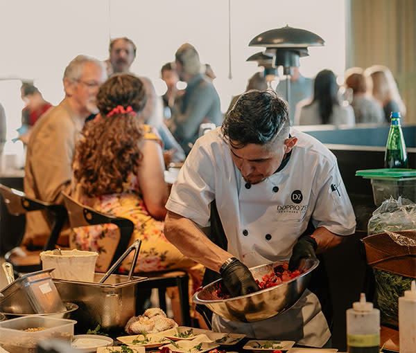 Chef preparing food at Flavors of the Peninsula 2026 Camber Tasting Event