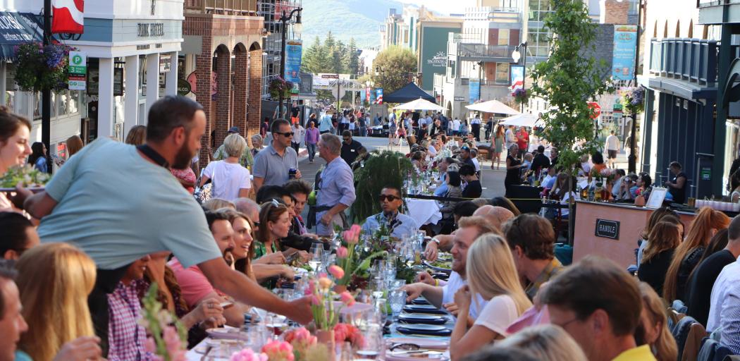 photo of people sitting at a table on Main Street Park City at the Savor the Summit event in 2012
