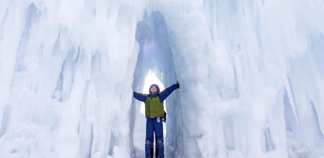 Boy standing in Ice Castle hallway