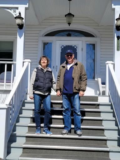 A photo of the first Cloghaun B&B guests of the 2022 season on the steps of the Mackinac Island bed and breakfast.