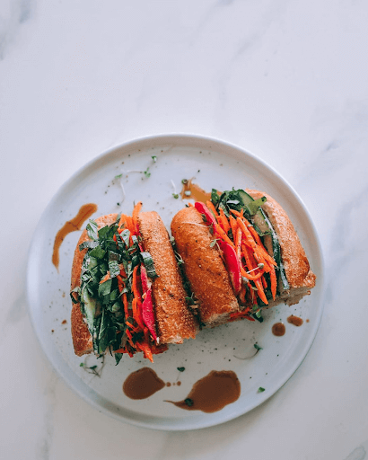 Veggie Banh Mi from Organic tree with Hummus. Ginger. Lime. Jalapeño. Pickled Carrot. Cucumber. Pickled Radish. Herbs