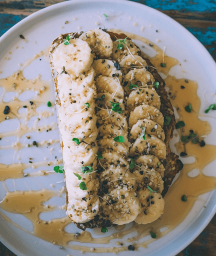 After School Toast from Organic Tree - 
Almond Butter. Banana. Sea Salt. Raw Honey. Hemp Seeds on a piece of toast