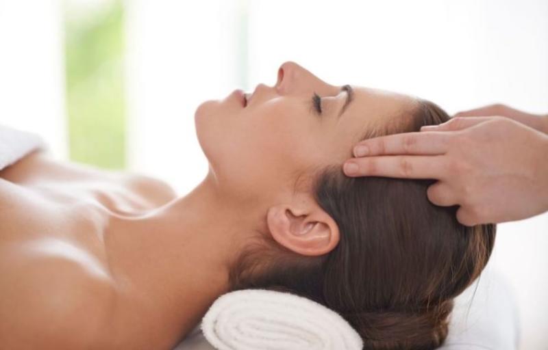 Woman getting a head massage at Mokara Spa