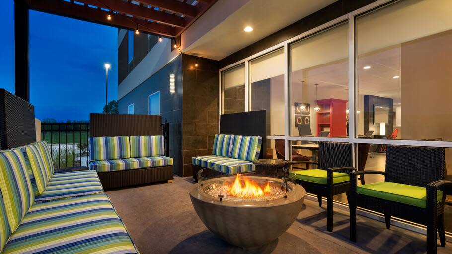 Home2 Suites Hotel exterior with fireplace