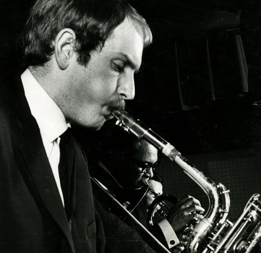 Karl Jenkins as a young man playing saxophone.