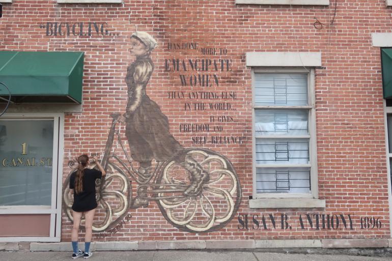 The Bicycling Woman Mural by Lucy Ray in Rochester, NY