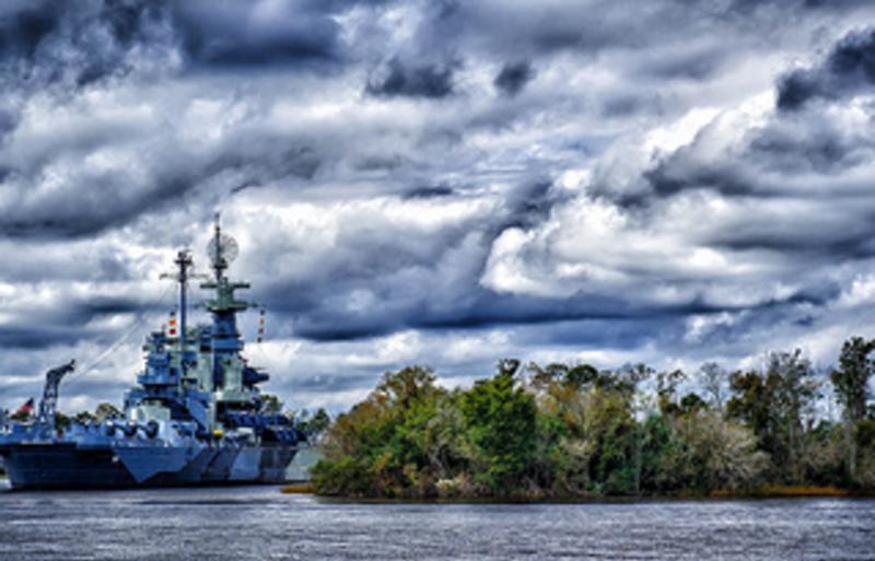 The Battleship North Carolina sitting in the waters of Wilmington, NC