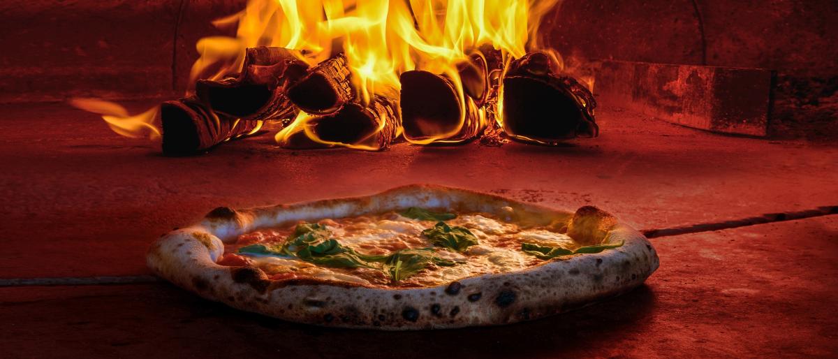 Wood-fired pizza being prepared inside the stone building at Market in the Gap in Hillsboro, Virginia