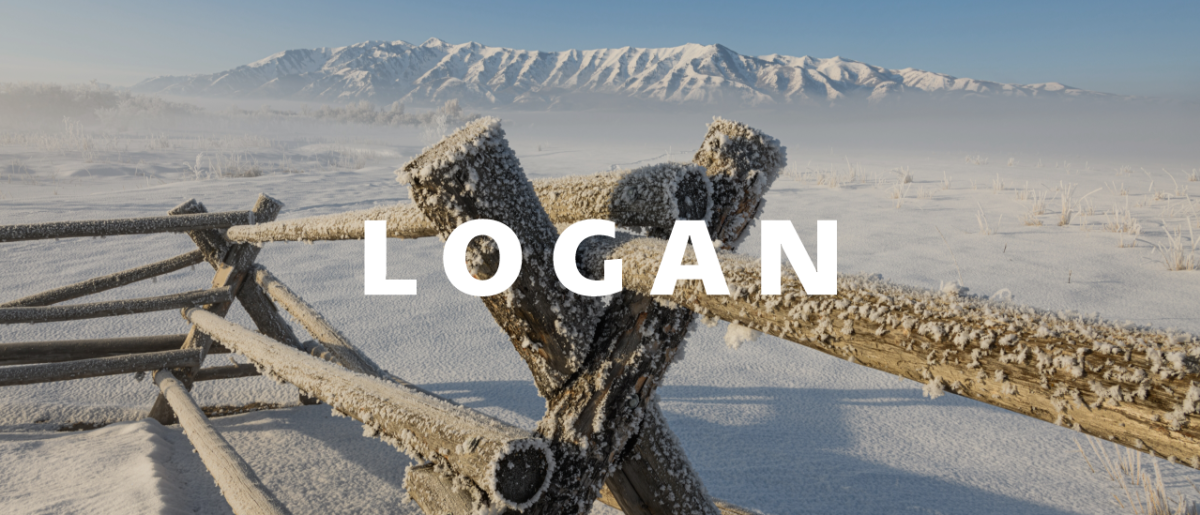 frosted wood fence with Logan mountains in the distance with the word Logan written over the top