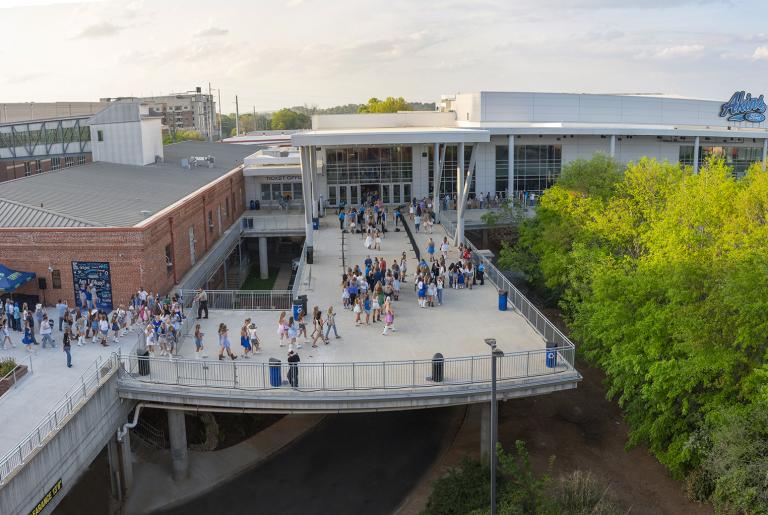 Akins ford arena entrance with crowd