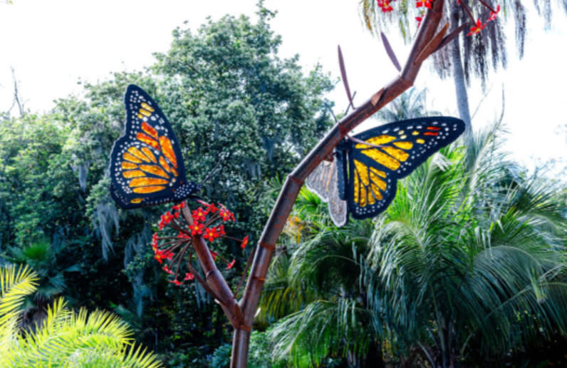 butterflies made out of glass and metal sit on display at botanica Wichita