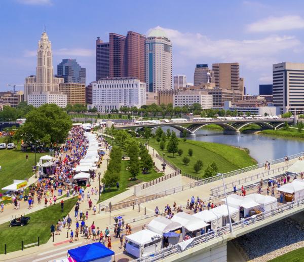 Crowd and booths along the riverfront at the Columbus Arts Festival