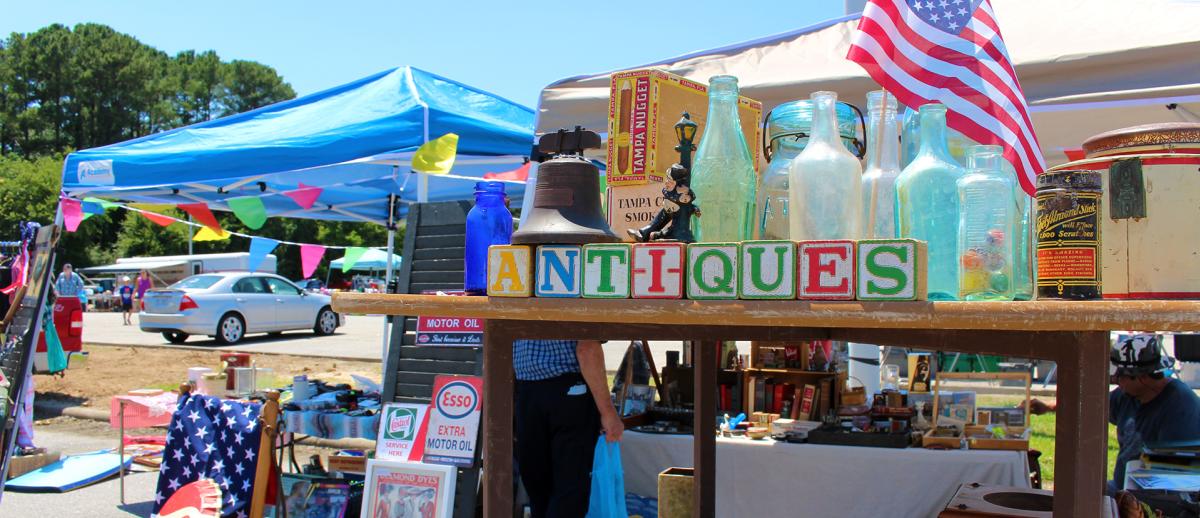 301 Endless Yard Sale collectable bottles and blocks spelling the word antiques.