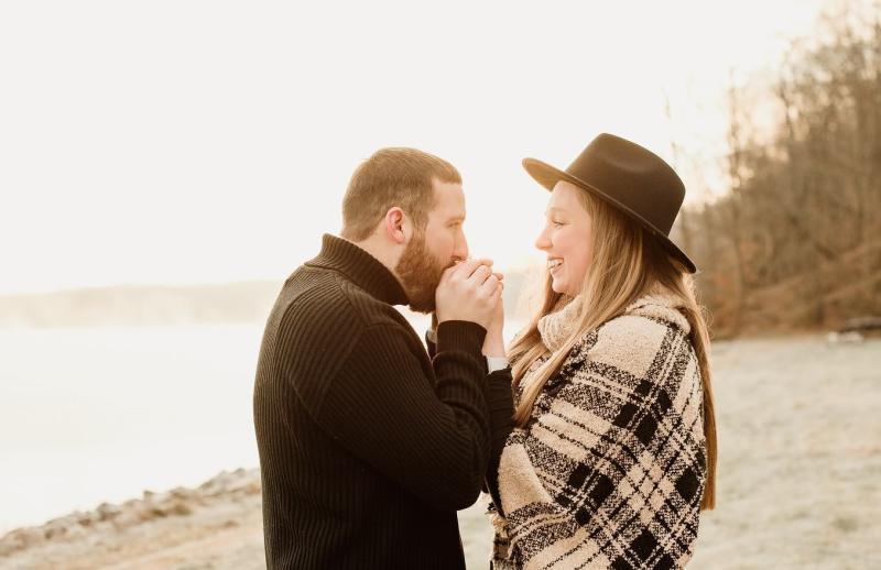 A couple on the shore of Monroe Lake