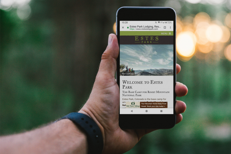 Visit Estes Park website on a mobile device.