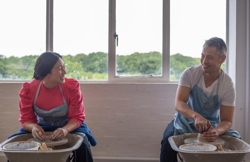 couple having fun throwing a pot