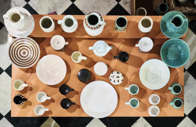 Locally made pottery displayed on a table for an Artist Market
