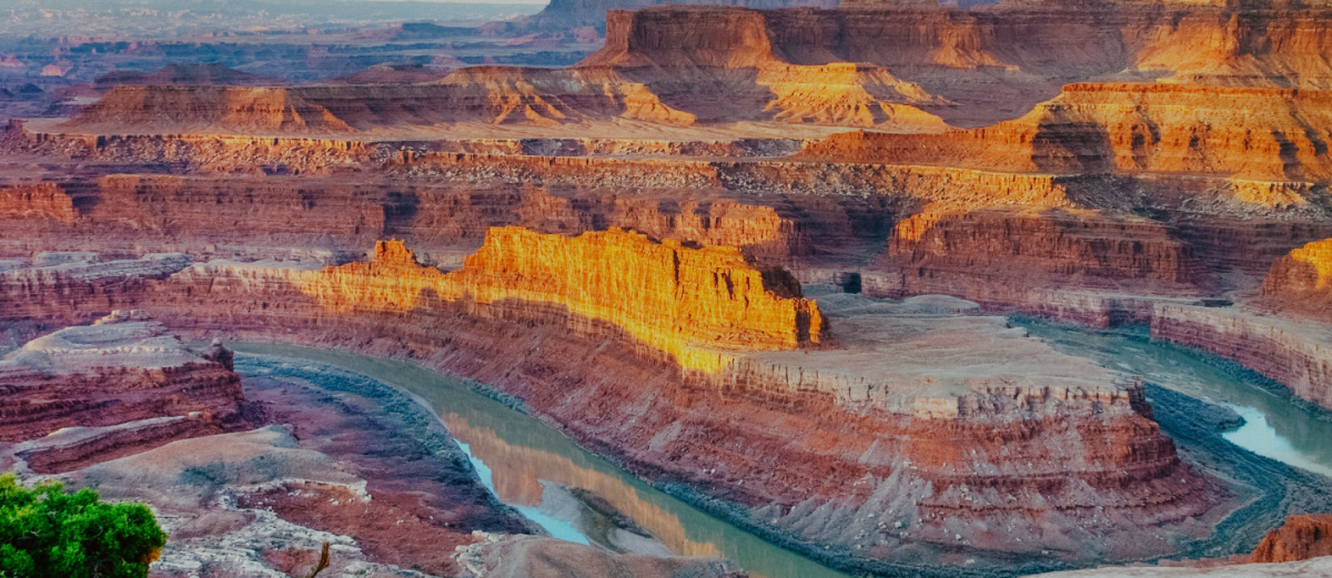 A breathtaking view of the gooseneck bend of the Colorado River from the iconic overlook at Dead Horse Point State Park near Moab, Utah.