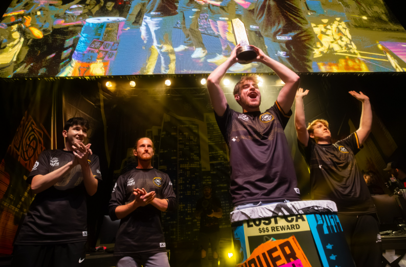 Spacestation Gaming winners holding up the 2023 trophee