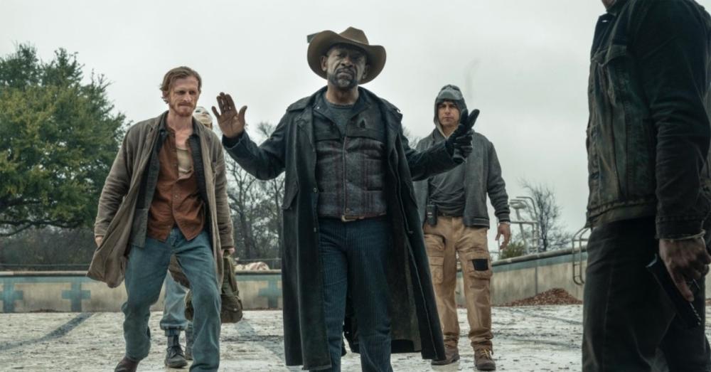 Fear the Walking Dead screengrab showing four men talking at an apocalyptic skate park