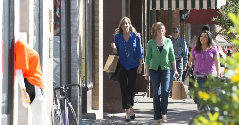 Three women with shopping bags