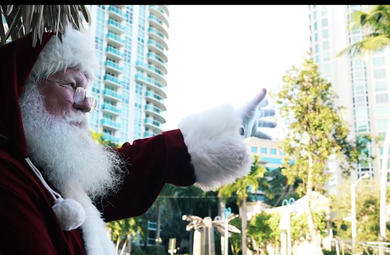 Santa waving from a Cruisin' Tiki on the New River in Fort Lauderdale